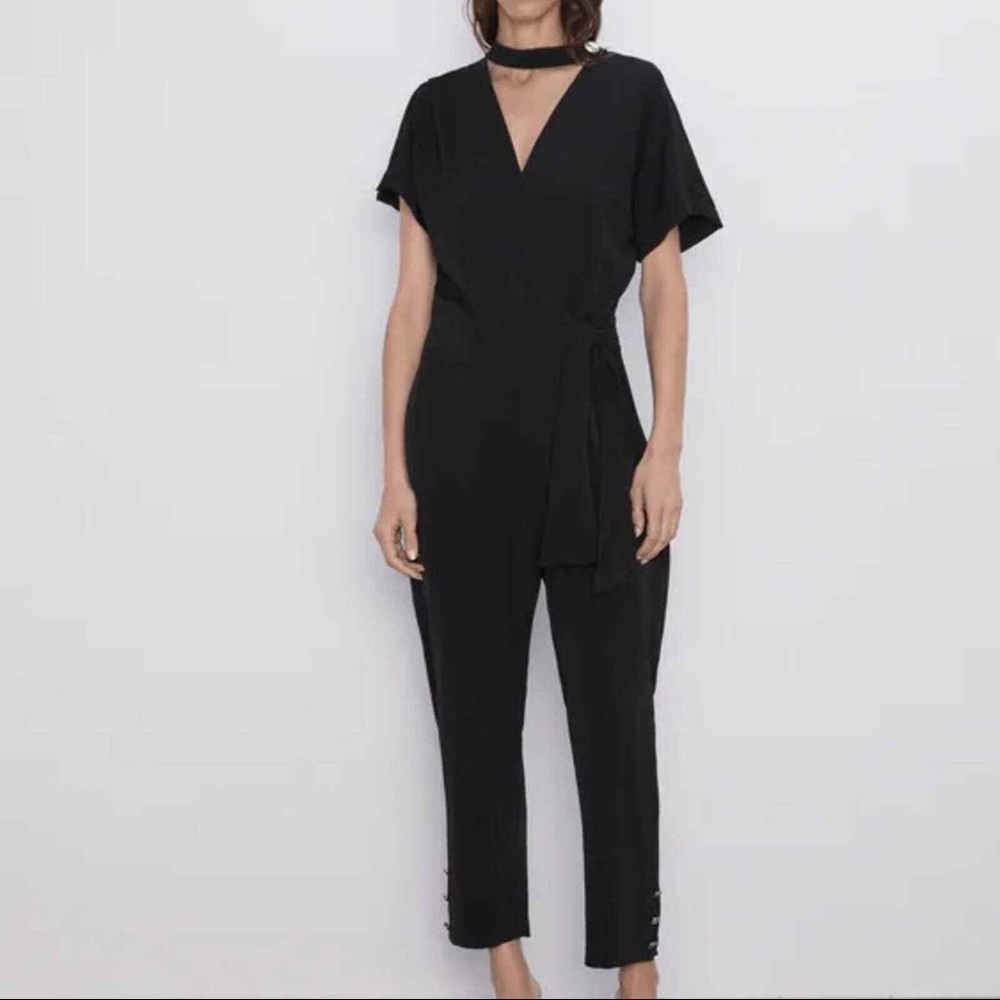 Black jumpsuit with gold buttons